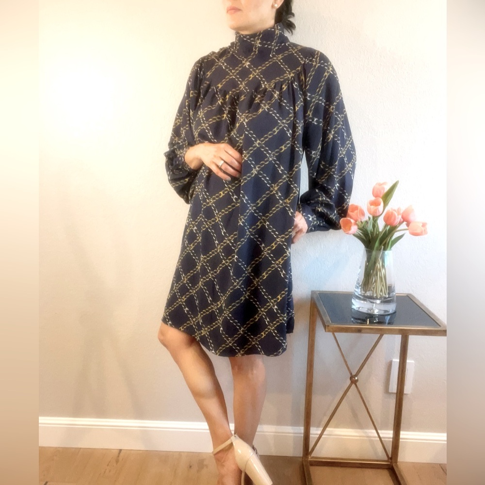 Boutique midi dress, sophisticated style, lantern sleeve, highneck button detail